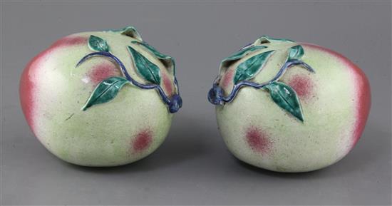 A pair of Chinese enamelled porcelain models of peaches, 19th century, length 16.5cm